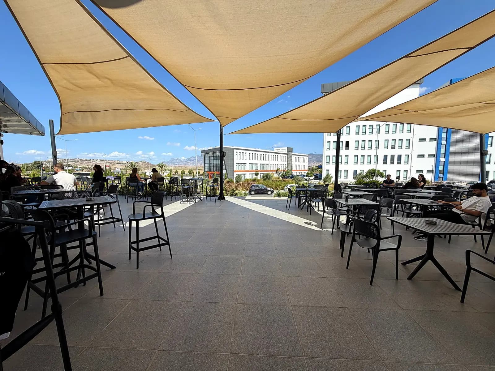Café terrace under sail shades