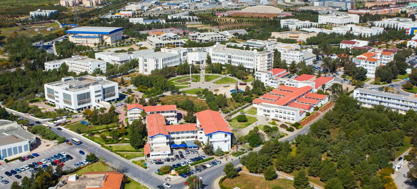 Central campus from the air, red-roofed faculty buildings