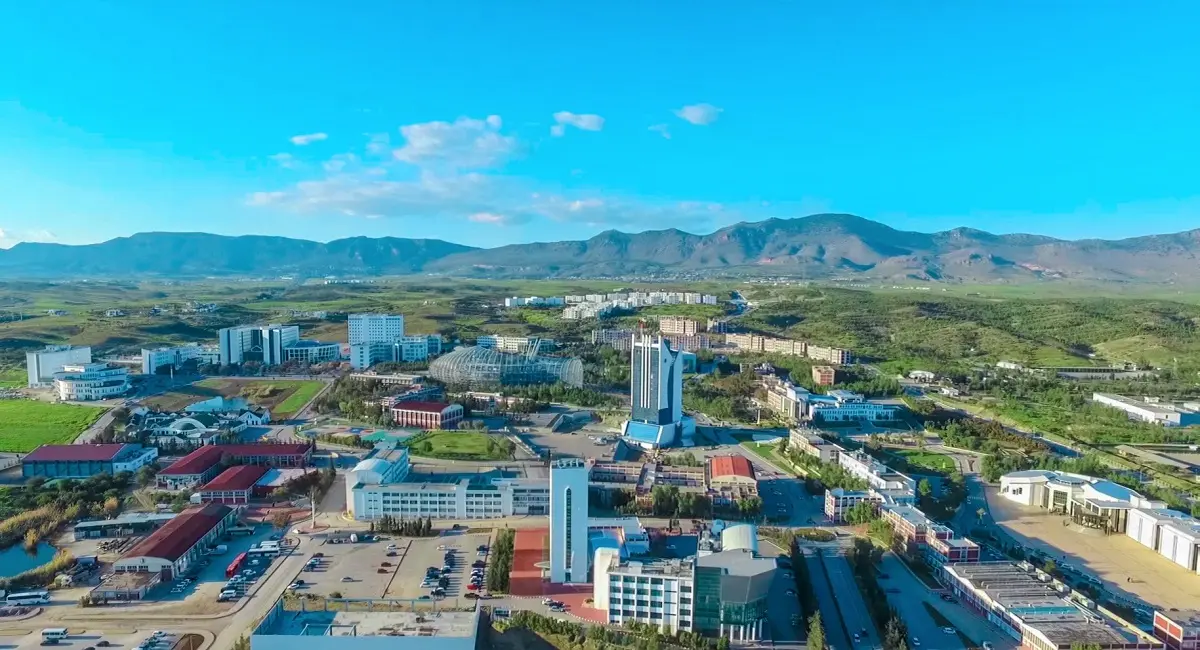 Campus from the air, mountains behind
